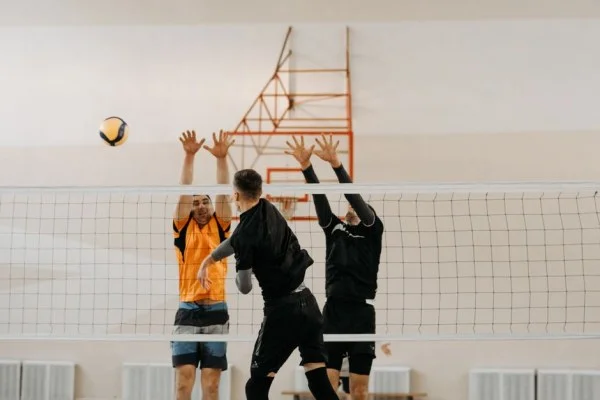 volleyball player blocking at net
